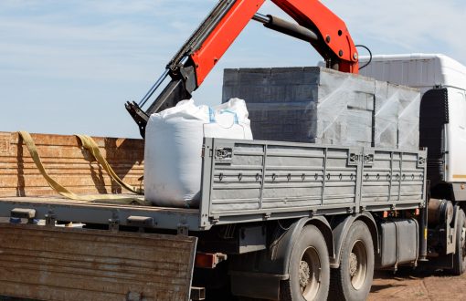 Mobile,Hydraulic,Crane,With,Construction,Material:,A,Bag,Of,Cement,